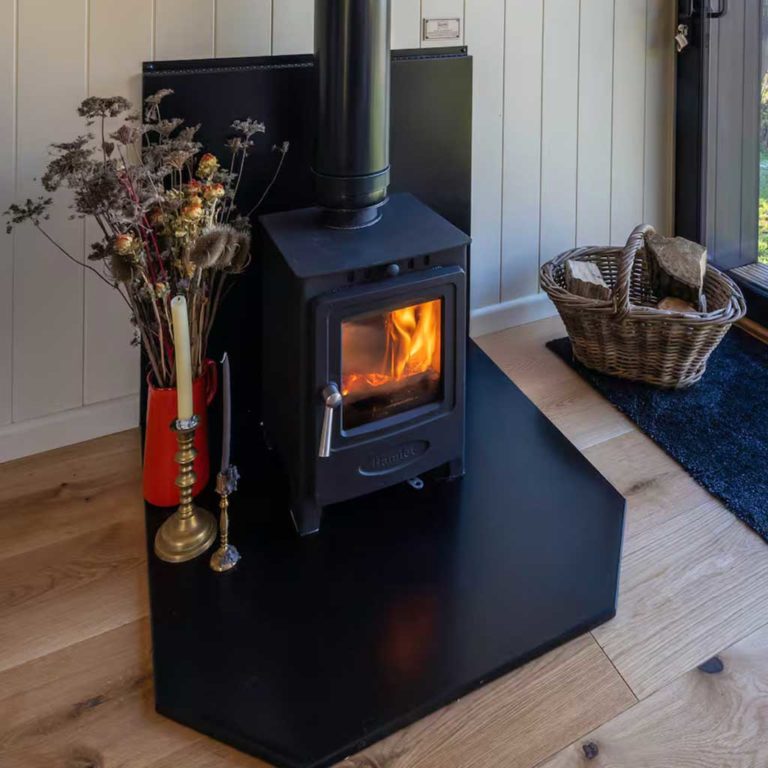 Bexington Ridge House, wood burner. Plankbridge shepherd's huts