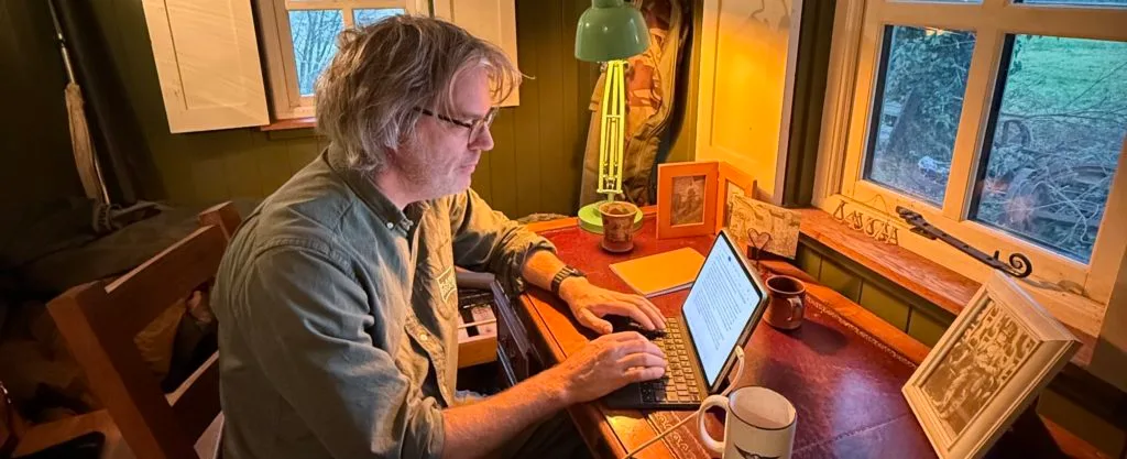 Richard Lee, writing in a Plankbridge shepherd's hut